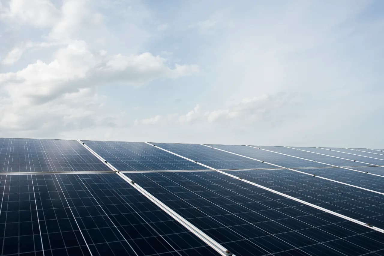 Solar panel array under a blue sky